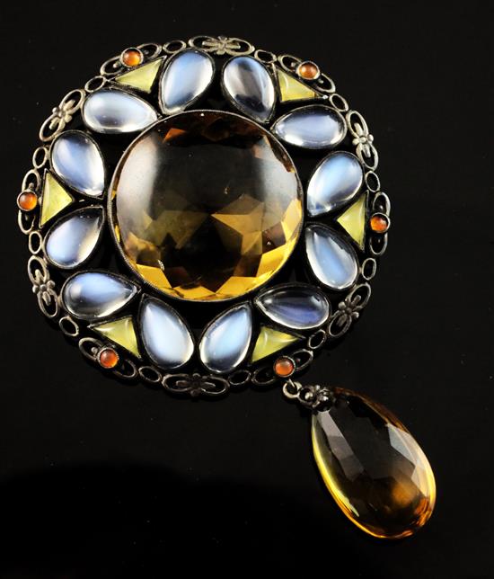 An early 20th century silver and gem set brooch in the manner of Sibyl Dunlop, dia.2in.